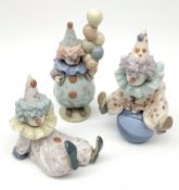 Three Lladro Clown figures: Littlest Clown, no.5811, Tired Friend, no.5812; and Having a Ball, no.58