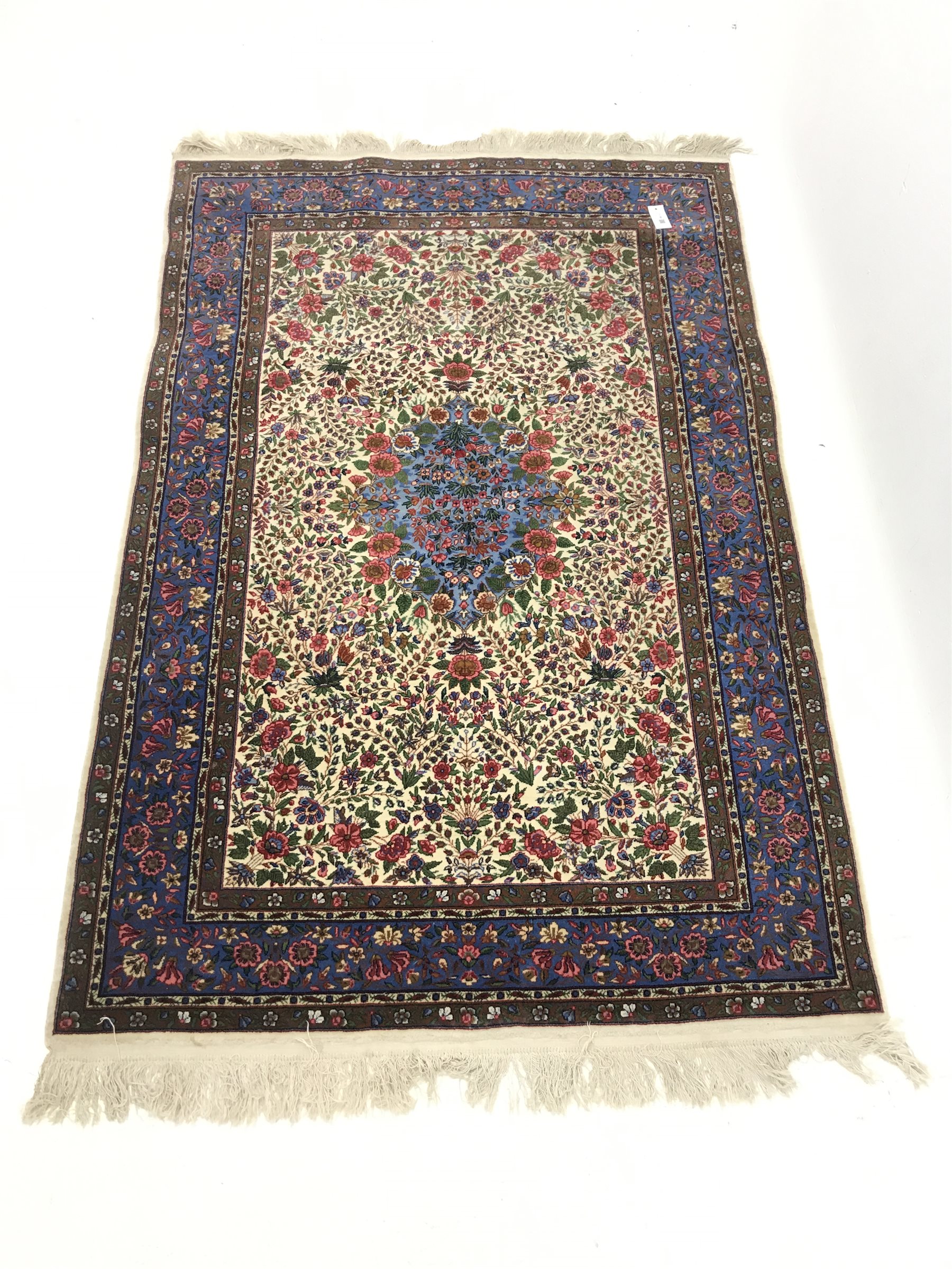 Persian beige ground rug carpet, central medallion with floral field and border, 185cm x 125cm