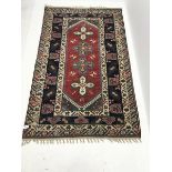 Persian style beige ground rug, field of four medallions, 237cm x 149cm