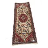 Persian red ground runner, central medallion, 195cm x 76cm