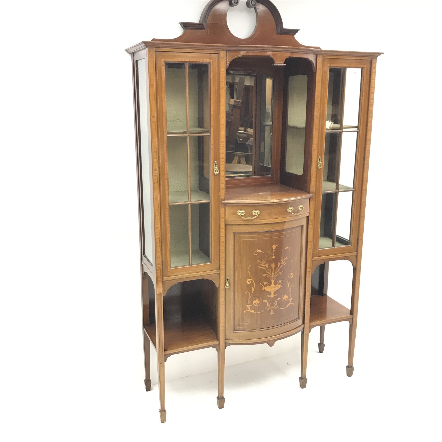 Edwardian inlaid mahogany breakfront display cabinet, swan neck pediment, mirrored centre, two glaze