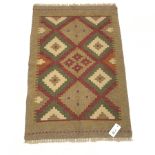 Hand stitched tan ground wool chain rug, 90cm x 60cm