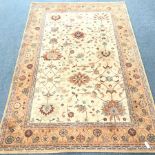 Keshan beige ground rug, repeating border, 300cm x 200cm