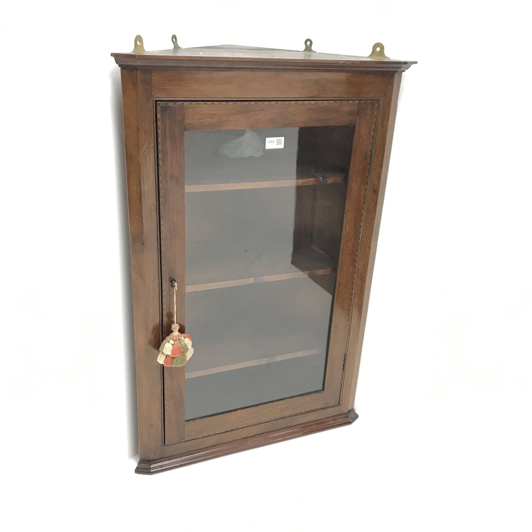 Edwardian inlaid mahogany corner cabinet, single glazed doors enclosing three shelves, W61cm, H91cm,