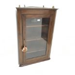 Edwardian inlaid mahogany corner cabinet, single glazed doors enclosing three shelves, W61cm, H91cm,