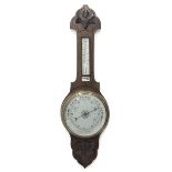 Early 20th century oak barometer, shaped pediment with foliage carved mount, mercury thermometer and