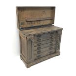 Late 19th century work bench tool cabinet, hinged lid enclosing tool rack, single vice, six graduati