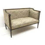 Edwardian mahogany framed two seat sofa, acanthus carved scrolling arms, turned tapering reeded supp