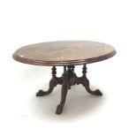 Victorian inlaid oval tilt top table, quadruple turned support with central finial on four acanthus