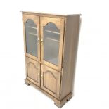 Jaycee - medium oak display cabinet, two glazed doors enclosing two shelves above two panelled cupbo