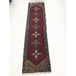 Persian red and blue ground runner, repeating border, 286cm x 75cm