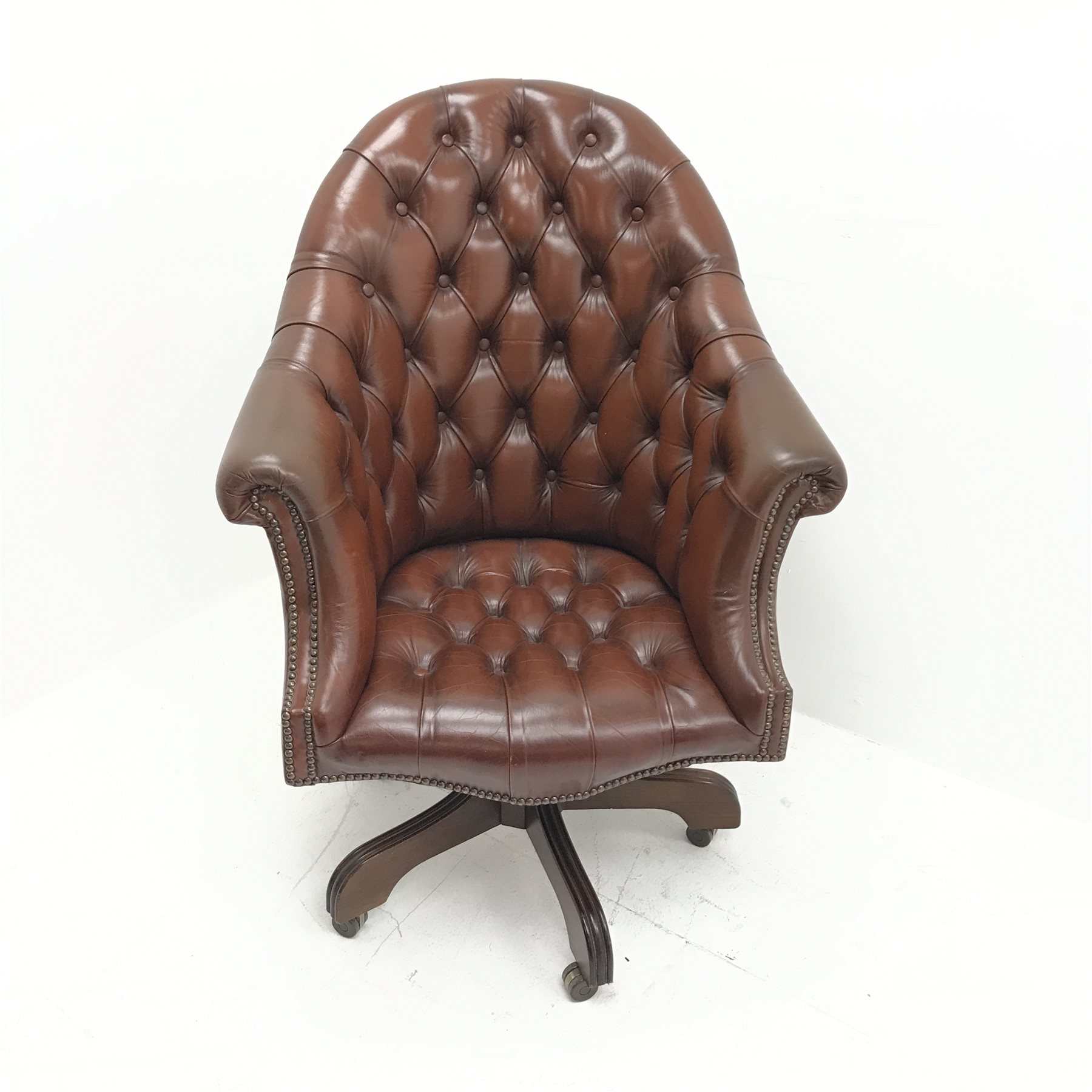 Library style swivel reclining desk chair, upholstered in deep buttoned and studded brown leather, f - Image 2 of 5