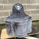 Early 20th century lead fountain, raised shaped back with moulded lions head spout, W74cm, H77cm, D4