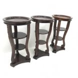 Three Classical style mahogany lamp tables, three carved shaped supports joined by two solid underti