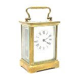 20th century brass cased carriage timepiece clock, white enamel Roman dial, single train driven move