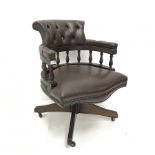 20th century swivel captains chair, upholstered in deep buttoned and studded chocolate leather, four