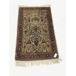 Small Persian beige ground silk rug, repeating border, 124cm x 79cm