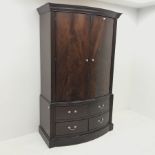 Georgian style mahogany bow front double wardrobe, two doors enclosing fitted interior above four dr