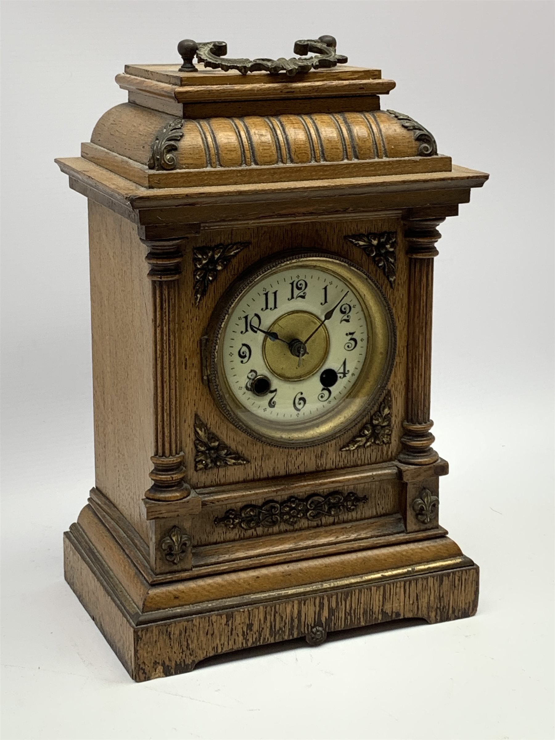 Late 19th century oak cased mantel clock, gadroon carved stepped pediment, circular dial with Arabic