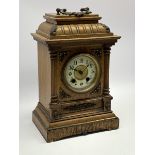 Late 19th century oak cased mantel clock, gadroon carved stepped pediment, circular dial with Arabic