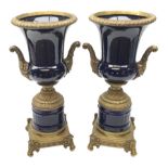 Pair of 19th century style cobalt blue twin-handled Campana urns, with bronzed mounts, raised upon f