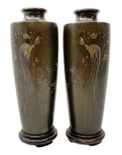 Pair of Meiji Period Japanese bronze vases, c1900, of slender baluster form, each inlaid with variou