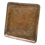 Herbert Dyer (1898-1974), an Arts and Crafts hammered copper tray, of square form decorated with fis