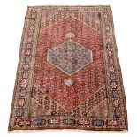 Persian Hamadan rug, lozenge red ground field decorated all over with stylised flower head motifs, p