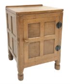 'Mouseman' panelled oak bedside cabinet, all over adzing, single door enclosing shelf, by Robert Tho