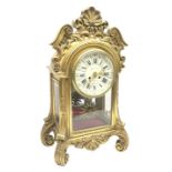 20th century French clock by Planchon Paris, decorative gilt case with shell pediment set on scrolle