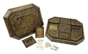 19th century Chinese black lacquer and gilt games box, of rectangular form with canted corners, the