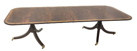 Regency style figured mahogany dining table, rounded rectangular crossbanded top with ebonised strin