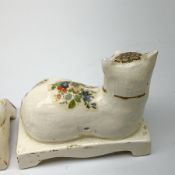 Pair of 19th century Staffordshire cats, modelled in recumbent pose, upon bases with bracket feet, l