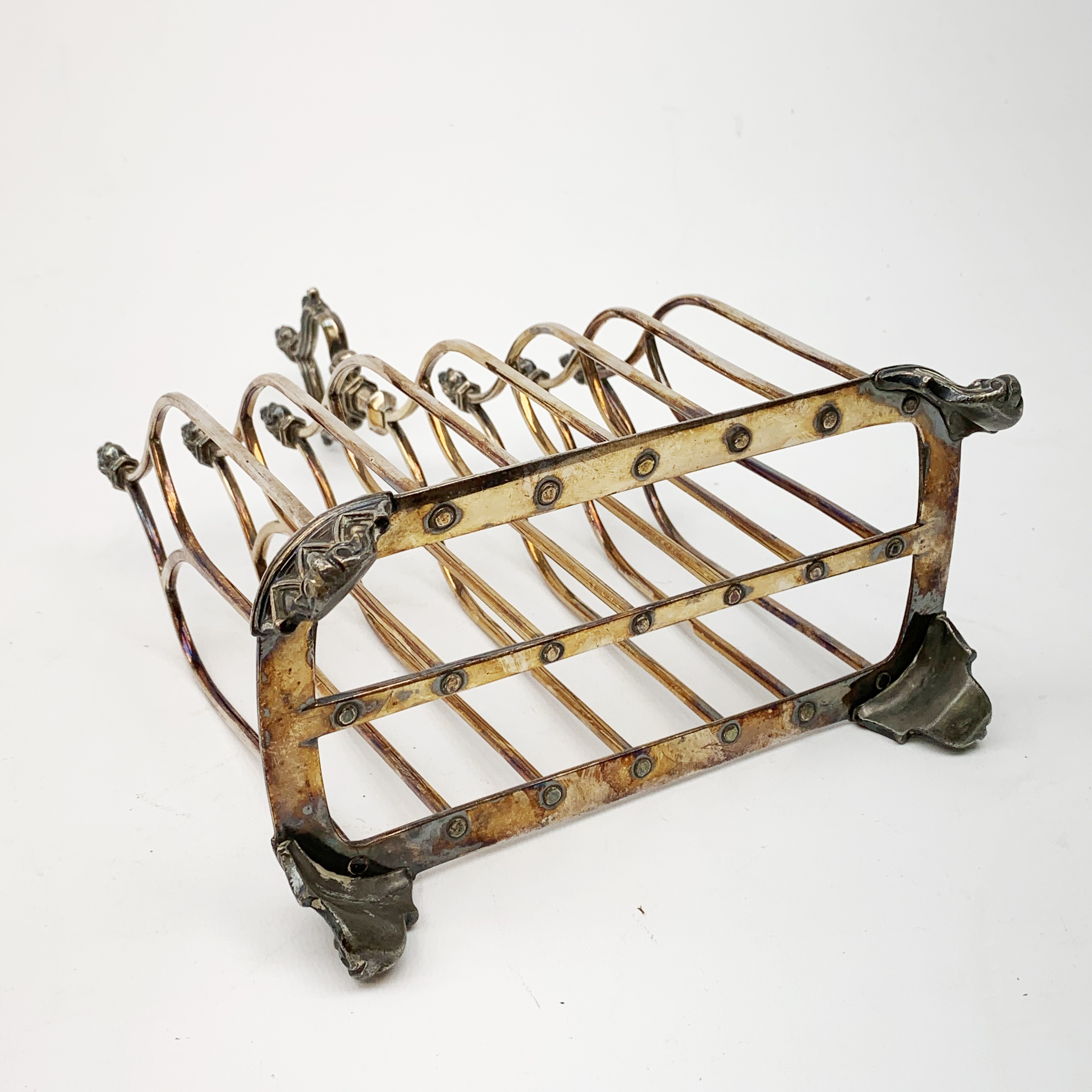 Victorian electroplate Gothic style toast rack, with seven arched bars, openwork handle and arcaded - Image 7 of 7
