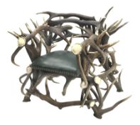 Red Deer Antler armchair, constructed from entwined Antlers, over a leather upholstered studwork se