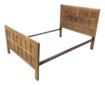 'Mouseman' 4' 6'' panelled oak bedstead with arcade carved cresting rails, by Robert Thompson of Kil