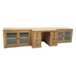 'Lizardman' oak kneehole desk fitted with six drawers and two glazed bookcases, by Derek Slater of C