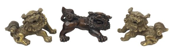 Japanese Meiji period boxwood Lion Dog, signed, L6cm, together with a similar bronze pair, (3)