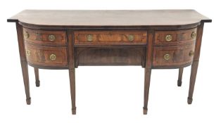 George III satinwood banded mahogany bow breakfront sideboard, three drawers and one cupboard, the f