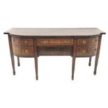 George III satinwood banded mahogany bow breakfront sideboard, three drawers and one cupboard, the f