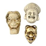 Group of three Japanese Meiji carved ivory mennetsuke/mask netsuke, comprising Hannya mask, Noh mask