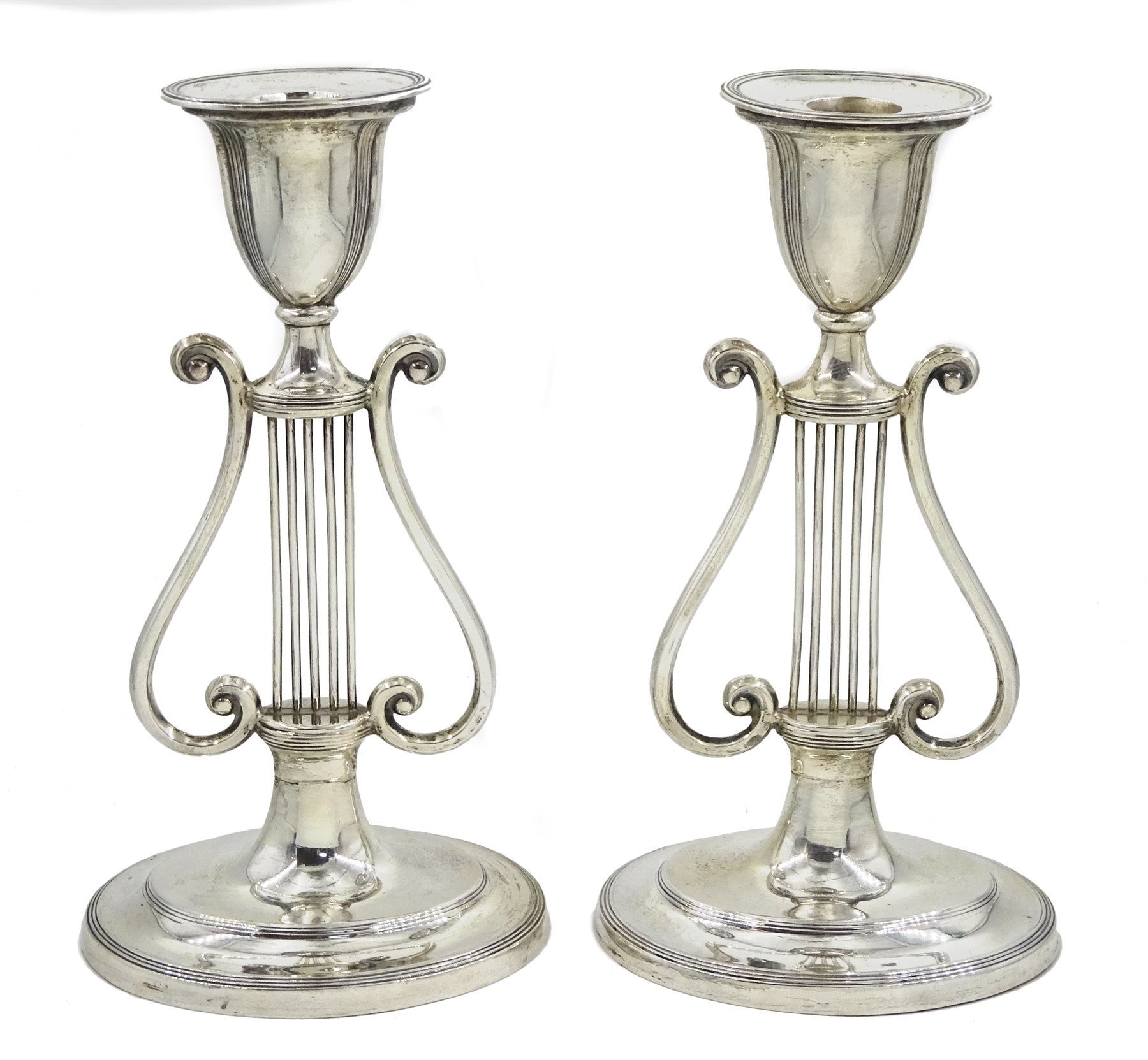 Pair of Edwardian silver stylised harp candlesticks by Sibray, Hall & Co Ltd, London 1911, H19.5cm