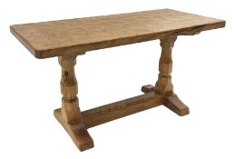 'Mouseman' oak coffee table, rectangular adzed top, two octagonal pillar supports on sledge feet con