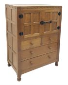 'Mouseman' panelled oak tallboy, panels and frame adzed, double cupboard above two short and two lon