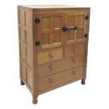 'Mouseman' panelled oak tallboy, panels and frame adzed, double cupboard above two short and two lon