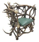Red Deer Antler armchair, constructed from entwined Antlers, over a leather upholstered studwork se