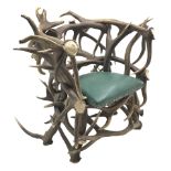 Red Deer Antler armchair, constructed from entwined Antlers, over a leather upholstered studwork se