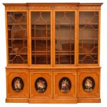 Sheraton Revival satinwood breakfront bookcase, frieze painted with scrolling leafage above four ast