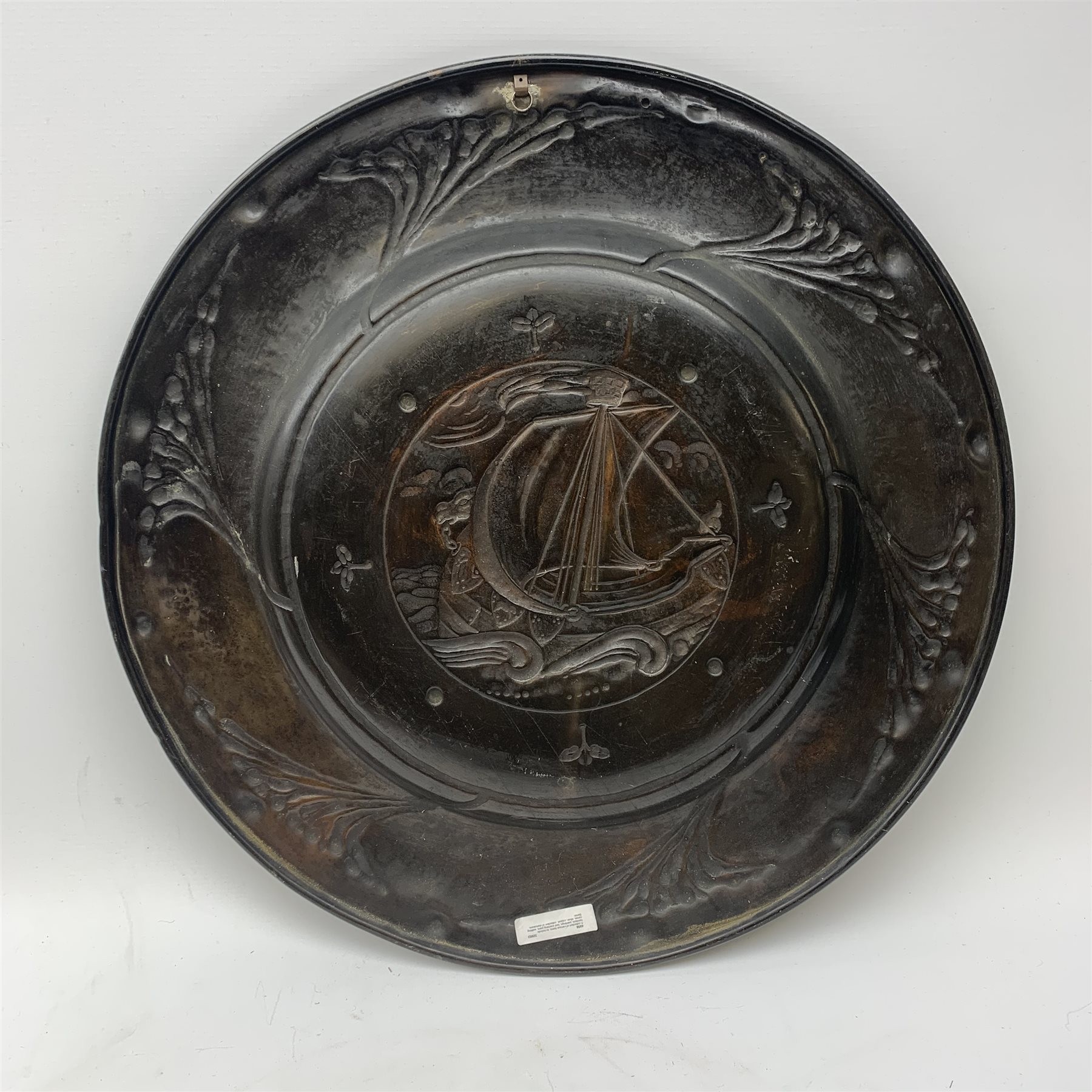 Large copper Arts and Crafts charger, possibly Newlyn, of circular form, repouss� decorated with a g - Image 2 of 3