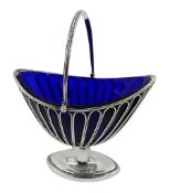 George III silver sugar basket, boat shaped design with openwork sides, swing handle and original bl